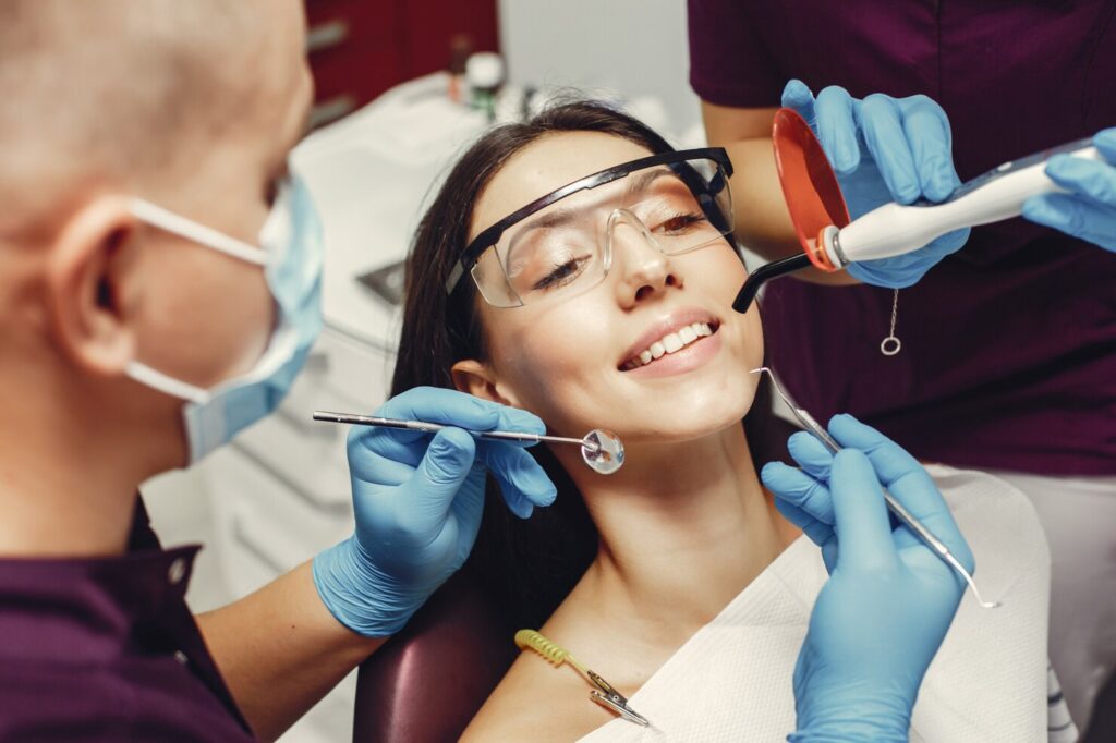 Patient smiling in the dental chair during a teeth cleaning visit