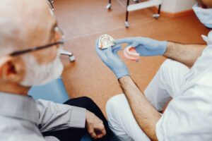 Discussing About Dental Implants Vs Dentures